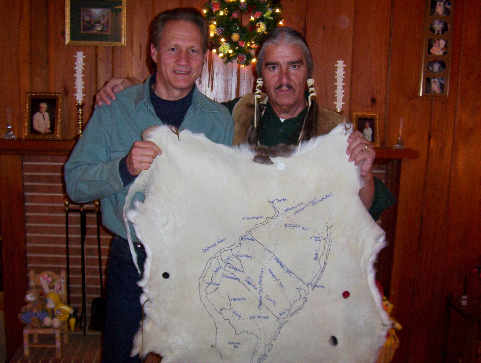 Greg and Chief Quiet Thunder in Delaware Jan. 2002 holding a deerskin map of the old Indian trails in New Jersey.